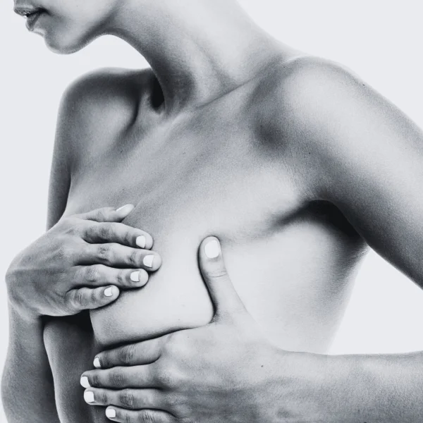 Woman doing a breast cancer check