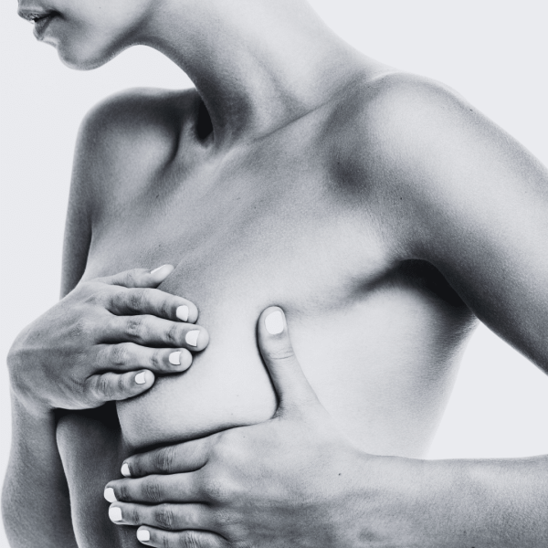 Woman doing a breast cancer check
