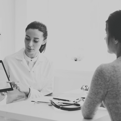 Doctor explaining exams to a patient after waiting for test results for cancer